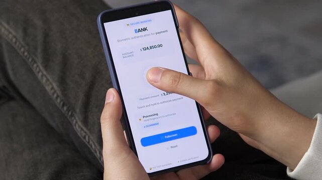 Trusted digital banking interaction. User uses biometrics to securely authorize a payment, ensuring privacy and safety. Top-tier footage for compliance marketing, identity protection