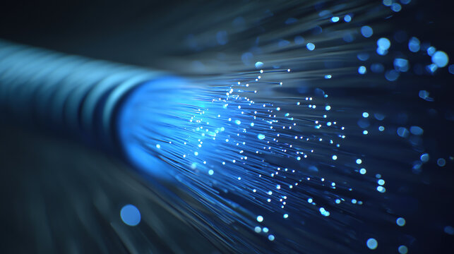 Macro shot of optical fibers glowing with blue light on a dark background. Concept of fast broadband connection and modern digital communication.