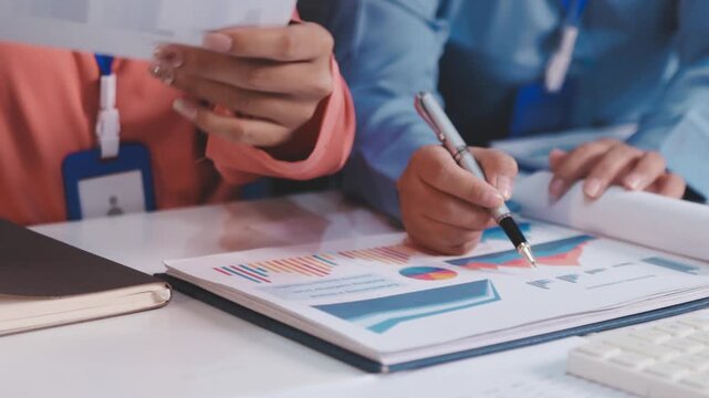 Asian business adviser meeting to analyze and discuss the situation on the financial report in the meeting room.Investment Consultant, Financial advisor and accounting concept