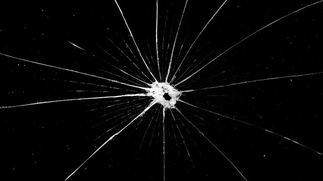 Cracked glass fracture effect on black background. fractures and a clean dark background for cinematic use. Breaking glass motion graphics. Cracked glass animation, transparent 4K video, Broken glass.