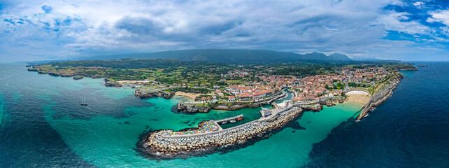 Aerial View of the Golden Sand Beach, Turquoise Ocean Water, and Sea Cliffs at Playa del Sablón Below Paseo de San Pedro in Llanes, Asturias, Northern Spain © Mike Workman