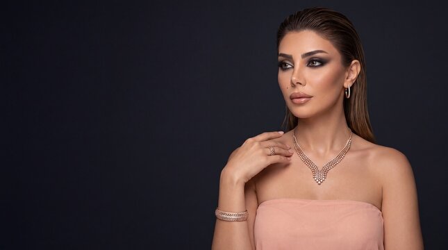 Fashion woman wearing luxury rose gold diamond necklace and ring jewelry set looking away on dark background