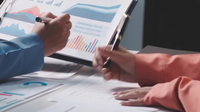 Asian business adviser meeting to analyze and discuss the situation on the financial report in the meeting room.Investment Consultant, Financial advisor and accounting concept