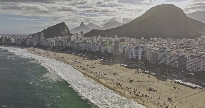 Rio de Janeiro Brazil Aerial v17 tracking flyover along Copacabana Beach, capturing Atlantic surf, dense beachfront cityscape and Leme hills - Shot with Mavic 3 Pro Cine - Mar 25th 2024