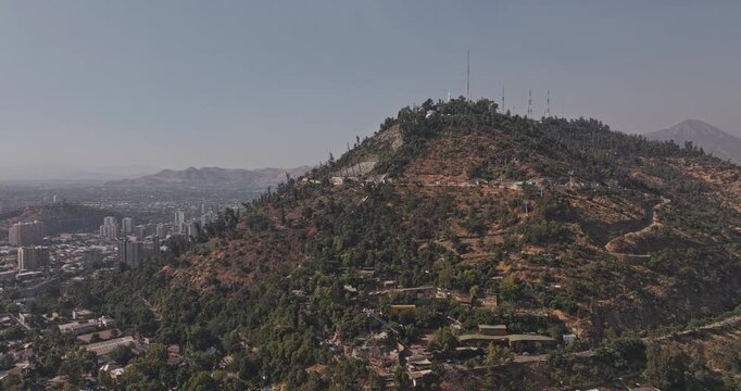 Santiago Chile Aerial v52 low rising flyover from Recoleta up Metropolitan Park, revealing rugged San Cristobal hillside and city views - Shot with Mavic 3 Pro Cine - Jan 24th 2025