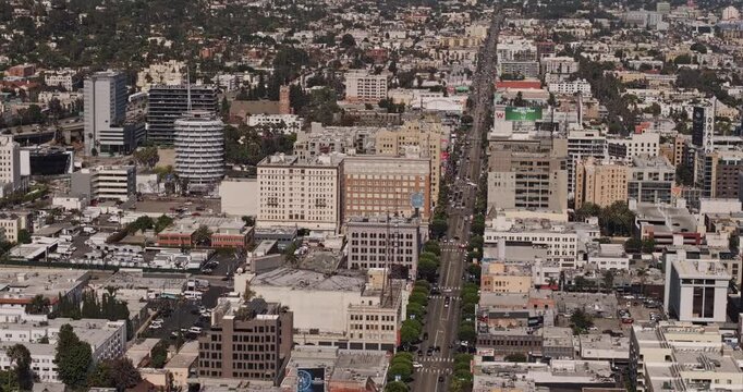 Los Angeles California Aerial v292 telephoto birds-eye flyover along Hollywood Boulevard, revealing urban buildings, hillside neighborhoods and downtown - Shot with Mavic 3 Pro Cine - May 26th 2024