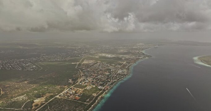 Bonaire Caribbean Netherlands Aerial v56 high reverse flyover through low clouds, revealing Hato, Kralendijk shoreline and Klein Bonaire across the channel - Shot with Mavic 3 Pro Cine - Feb 3rd 2024