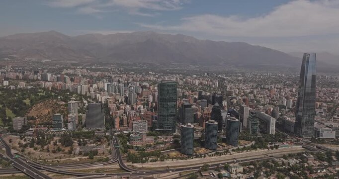 Santiago Chile Aerial v13 flyover above Providencia and Las Condes, revealing modern business towers, dense cityscape and Andes backdrop - Shot with Mavic 3 Pro Cine - Jan 20th 2025