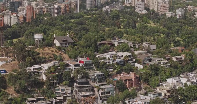 Santiago Chile Aerial v21 telephoto birds-eye orbit over Las Condes and Barrio El Golf, revealing hillside homes and dense neighborhoods - Shot with Mavic 3 Pro Cine - Jan 20th 2025