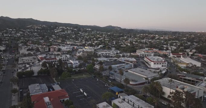 Los Angeles California Aerial v308 sweeping orbit above Pacific Palisades Village, revealing coastal neighborhoods, cityscape and Pacific Ocean at sunset - Shot with Mavic 3 Pro Cine - May 26th 2024