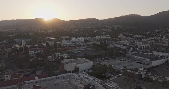 Los Angeles California Aerial v307 orbit around Pacific Palisades Village, revealing hillside neighborhoods and commercial streets beneath a warm sunset - Shot with Mavic 3 Pro Cine - May 26th 2024