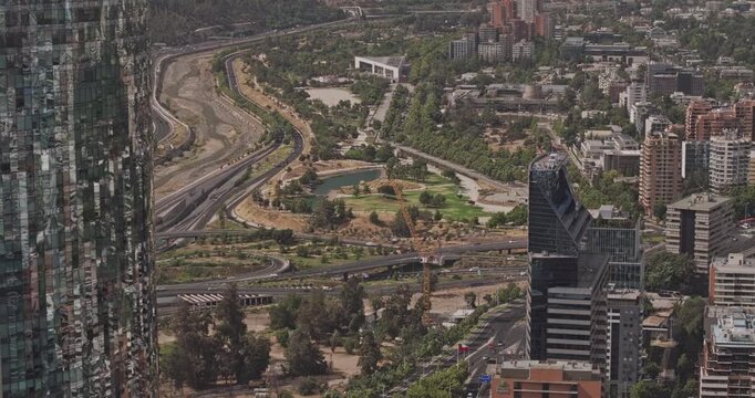 Santiago Chile Aerial v18 telephoto birds-eye flyover revealing Bicentenario Park, Vitacura, Las Condes, highways and green hillsides - Shot with Mavic 3 Pro Cine - Jan 20th 2025