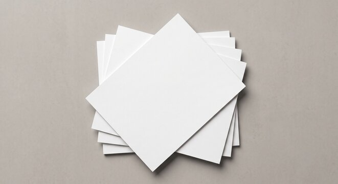 Top down flat lay mockup of a stack of blank white paper flyers on a clean background with soft drop shadows.