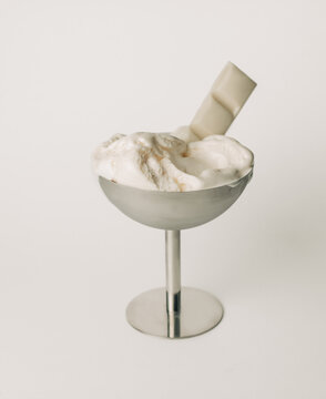 Vanilla ice cream with white chocolate in metal bowl