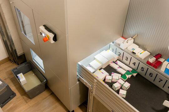 Automated pharmacy machine dispensing medicine packages