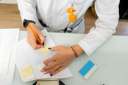 Pharmacist write note on barcode medicine record sheet
