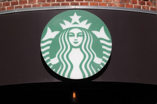 Aarhus, France - April 29, 2026: Starbucks logo on a wall. Starbucks is an American coffee company and coffeehouse chain