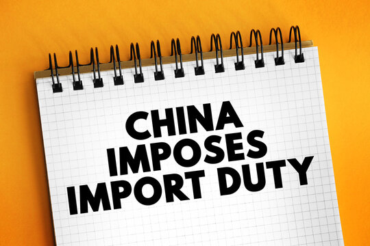 CHINA IMPOSES IMPORT DUTY text printed on a squared page. This business concept highlights international trade conflicts, tariffs, global economic relations, and regulatory changes in import-export.