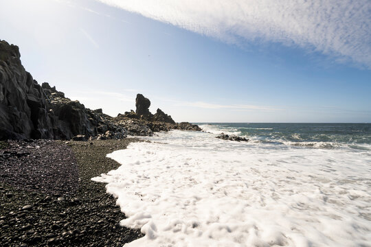 Black sand beach and volcanic cliffs in Iceland