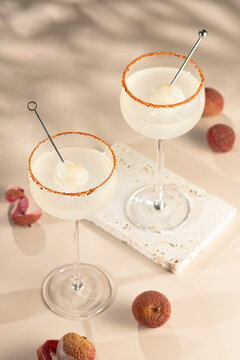 Lychee cocktail in coupe glass with spiced rim