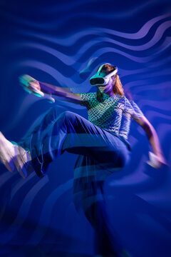 Young woman experience virtual reality with dynamic motion blur