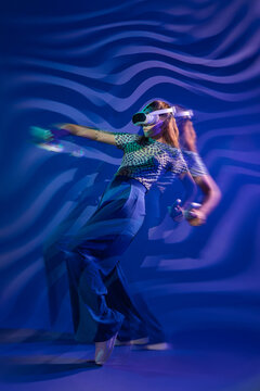 Young woman explore virtual reality with motion blur