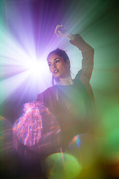 Latin woman dancer in colorful futuristic light portrait