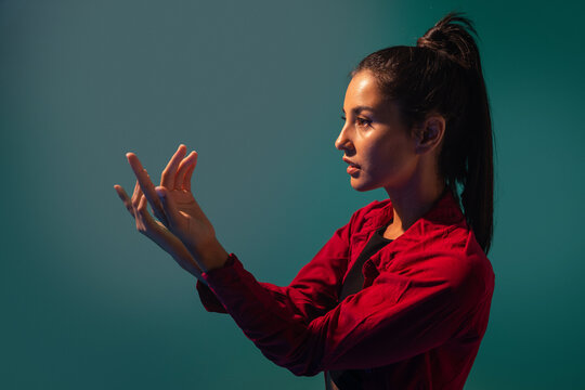 Latin woman dancer performing expressive hand gesture