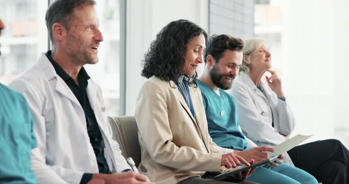 Medical, happy or people in hospital with presentation, crowd or policy review in clinical brief. Smile, audience or doctors with tech, staff engagement or compliance education in healthcare meeting.