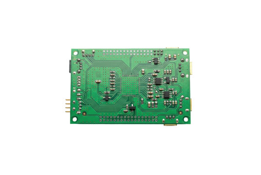 Green electronic circuit board with microchips on black background