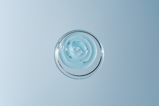 Clear cosmetic gel texture in a glass Petri dish