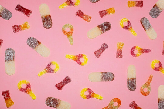 Assorted Sugar Coated Gummy Candy on Pink Background