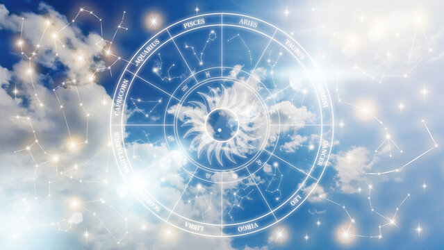Astrology zodiac signs display in a bright sky with clouds and constellations visible