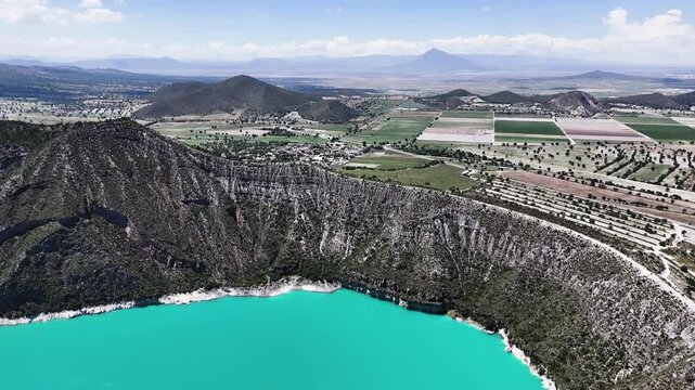 Aerial video of half lagoon, rocks and beach near Puebla, Mexico
