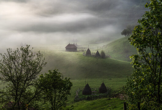 Morning mist over Fundătura Ponorului village, Romania