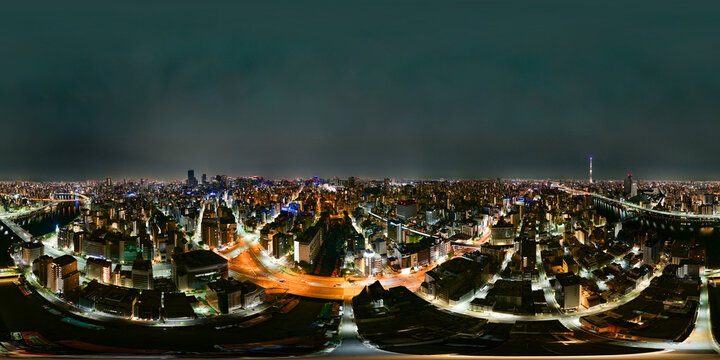 Tokyo aerial night 360 panorama with illuminated skyline and urban city lights