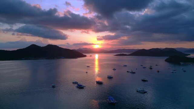 Coron Islands sunset with boats on tranquil water. Fabulous aerial view drone