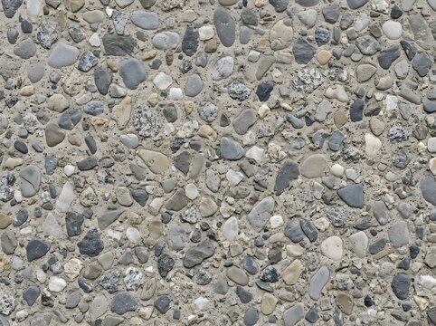 Close up of mixed pebbles and stones texture with neutral gray and beige tones