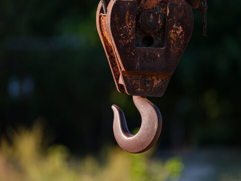 Old iron hook on a cargo ship in the harbor