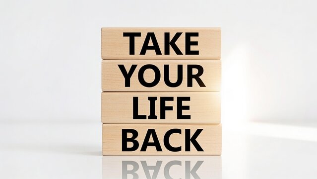 Wooden blocks with motivational message Take Your Life Back on white surface