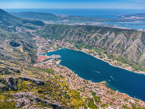 Bay of Kotor featuring an ancient coastal town nestled between towering mountains and the deep blue Adriatic Sea