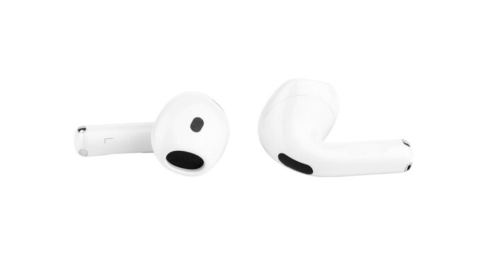 Pair of white Apple AirPods 4 wireless earbuds close up, fourth generation bluetooth headphones isolated from background