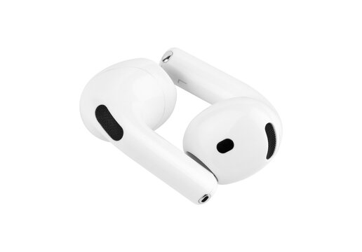 Pair of white Apple AirPods 4 wireless earbuds close up, fourth generation bluetooth headphones isolated from background