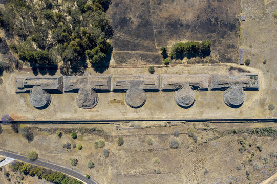 Aerial view of the Yacatas at the Tzintzuntzan Archaeological Zone, featuring five ancient circular stone structures aligned in a row, in Tzintzuntzan, Michoacan, Mexico.