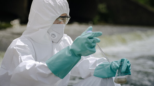 Close Up of Environmental Water Sample Testing Using Scientific Pipette