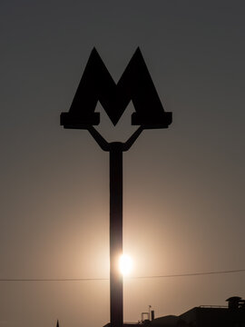 Moscow Metro Logo Silhouette Against Sunset