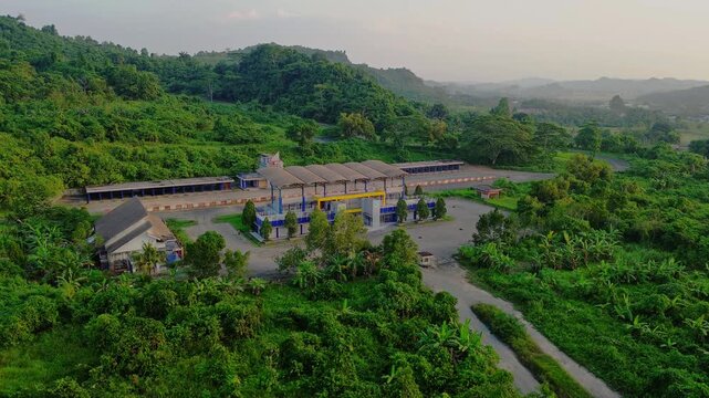 Aerial view of Kalan Circuit surrounded by lush greenery and hills in Samarinda, East Kalimantan, Indonesia.