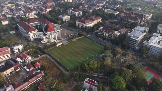 Morning aerial view of the football field of the integrated campus of the Islamic University of Indonesia, the first and oldest national private university in Indonesia located in Yogyakarta.