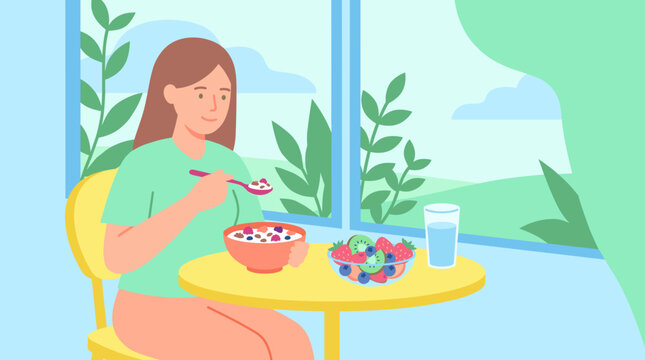 Young woman enjoys healthy breakfast at home. She eats oatmeal with vibrant berries and a glass of water. Soft light filters through large windows. Nature scenes frame her calm, contented moment