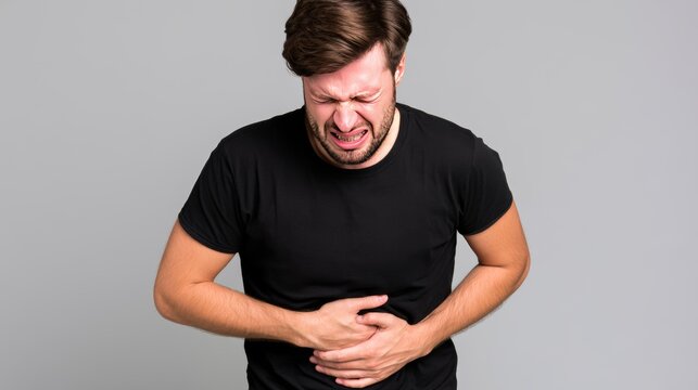 Man suffering severe stomach pain and cramps after eating contaminated shredded iceberg lettuce, showing foodborne illness symptoms, digestive discomfort, salad recall concerns, and health risks